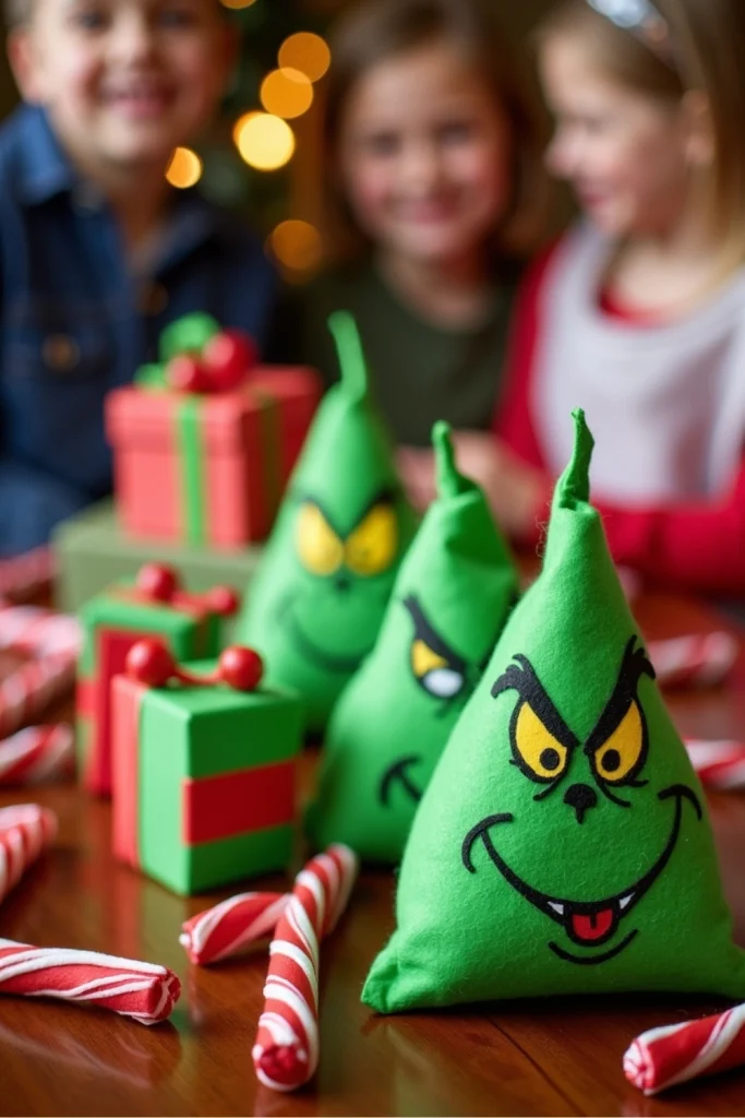 "Grinch-themed bean bag toss with green felt bags and colorful gift box targets at a holiday party."